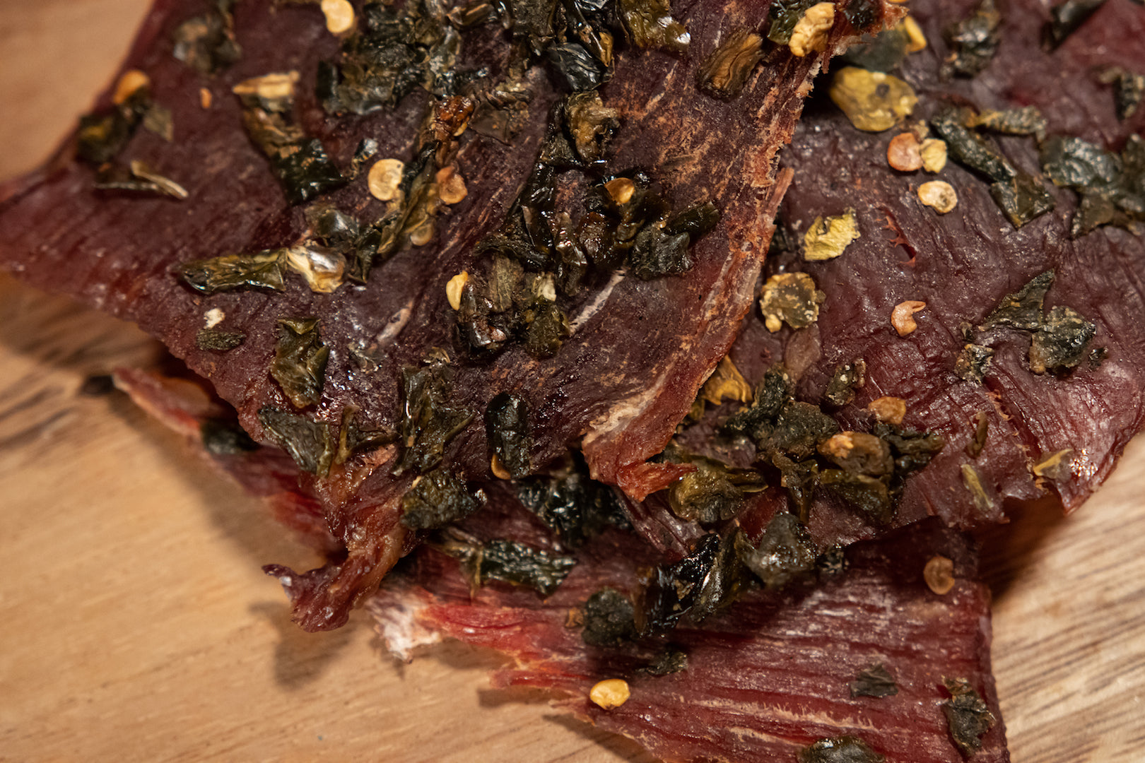 close up jerky picture showing jalapeño chips on the beef jerky